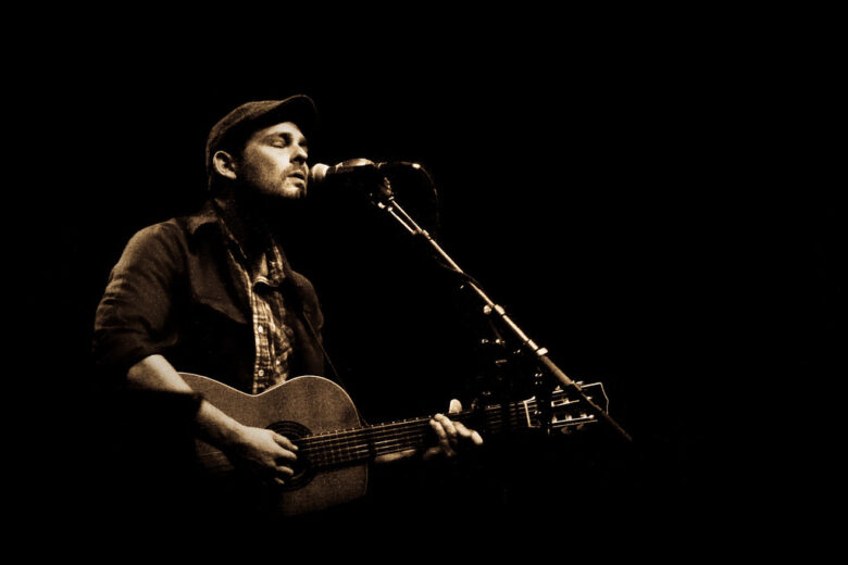 This image is Gregory Alan Isakov performing his music.