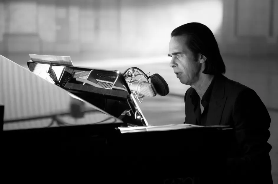 This image is about Nick Cave performing his music